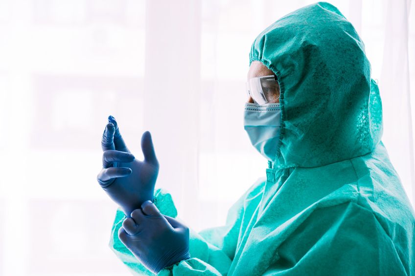 Doctor profession with ppe vaccine. Professional waring doctor in protective suit and face mask. Man scientist specialist in medicine working with coronavirus infection vaccine.