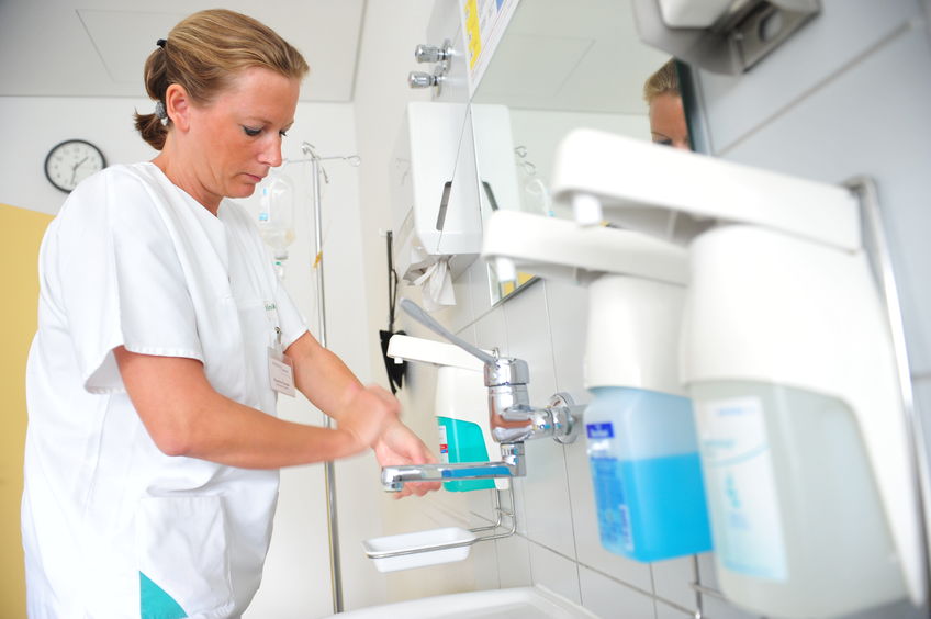 a vet washing her hands